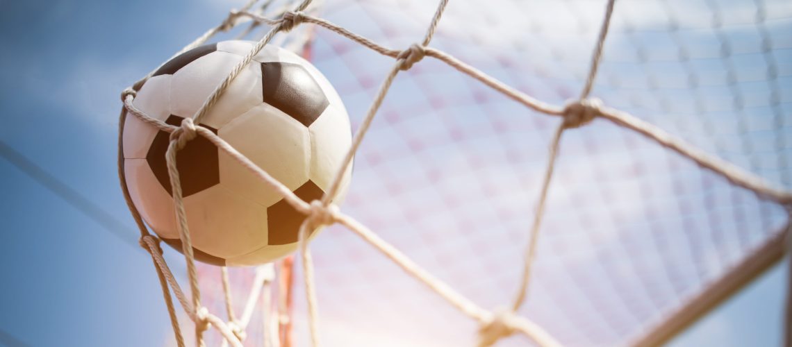 Soccer into goal success concept